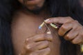 Jewelry maker hands creating earrings from metal string