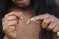 Jewelry maker hands creating earrings from metal string