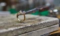 Jewelry production. The jeweler makes a gold ring