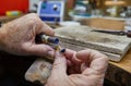 Jewelry production. Jeweler polishes a gold ring