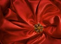 Jewelry Shape over Red Silk Cloth Background, Fabric folds Royalty Free Stock Photo