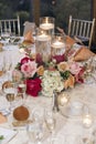 Jewelry at the wedding ceremony. Beautiful candle decoration of the wedding hall in the restaurant. Flowers on the table Royalty Free Stock Photo