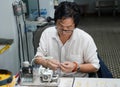 Jewelry worker setting produced high-quality pearl at Tung Sau Pearl Farm in Vietnam