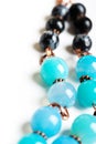 Jewerly with chalcedony and obsidian around white background