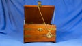 Jewerly pendant that was made using gold sovereign coin on wooden present box