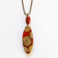 Jewerly wooden pendant on white background