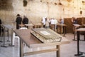 Jewish bible - Torrah on table on blurred background of praying Jews and wailing western wall. Israel. Jerusalem Royalty Free Stock Photo