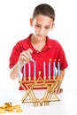 Jewish Boy Lights Menorah Royalty Free Stock Photo