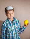 Jewish boy wearing a white skullcap