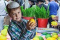 The Jewish boy in white skullcap with etrog