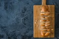 Jewish challah bread, sliced on black background