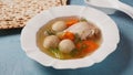 Jewish chicken broth with kneidlach (balls made with matzo meal). Matzo ball soup