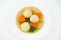 Jewish chicken broth with kneidlach (balls made with matzo meal). Matzo ball soup