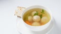 Jewish chicken broth with kneidlach