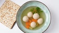 Jewish chicken broth with kneidlach