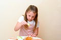 Jewish child dipping apple slices into honey on Rosh HaShanah. Royalty Free Stock Photo