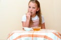 Jewish child dipping apple slices into honey on Rosh HaShanah. Royalty Free Stock Photo