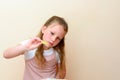 Jewish child dipping apple slices into honey on Rosh HaShanah. Royalty Free Stock Photo