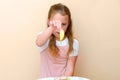 Jewish child dipping apple slices into honey on Rosh HaShanah. Royalty Free Stock Photo