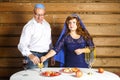 A Jewish family, a husband in a kippah and a wife in a cape on their heads in Rosh Ashana eat challah in honey at a Royalty Free Stock Photo