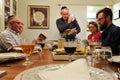 Jewish family reading the Haggadah during Passover Jewish holiday