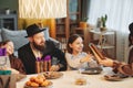 Jewish Family Sharing Presents at Dinner Table