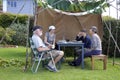 Jewish Family Sitting in a Sukkah on Sukkoth Feast of Tabernacle Royalty Free Stock Photo