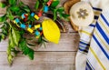 Jewish festival of sukkoth over paper colorful chain garland on kippah