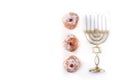 Jewish Hanukkah menorah and sufganiyot donuts isolated on white background