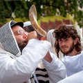 Jewish hasid blows Shofar. Rosh Hashanah, Jewish New Year.