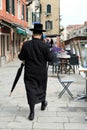 Jewish Hasidic Man with an umbrella walking in the street in the Jewish Quarter Royalty Free Stock Photo