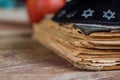 The Jewish hebrew prayer book on synagogue with kippah Royalty Free Stock Photo