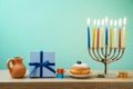 Jewish holiday Hanukkah background with menorah, sufganiyot, gif Royalty Free Stock Photo