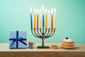 Jewish holiday Hanukkah background with menorah, sufganiyot, gif Royalty Free Stock Photo