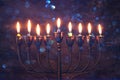 jewish holiday Hanukkah background with menorah & x28;traditional candelabra& x29; and burning candles