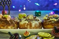 Jewish holiday Hanukkah background. A traditional dish is sweet donuts. spinning tops on a blue background and Hanukkah money-gelt