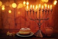 jewish holiday Hanukkah background with traditional spinnig top, menorah & x28;traditional candelabra& x29; and burning candles Royalty Free Stock Photo