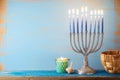 Jewish holiday Hanukkah concept with menorah on vintage background