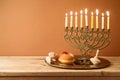 Jewish holiday Hanukkah concept with vintage menorah and candles on wooden table Royalty Free Stock Photo