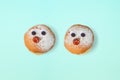 Jewish holiday Hanukkah cute traditional donuts sufganiyot characters over blue background