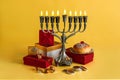 Jewish holiday Hanukkah with menorah, donuts and wooden dreidels, doughnut Royalty Free Stock Photo