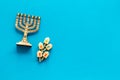 Jewish holiday Hanukkah with menorah - traditional Candelabra - and wooden dreidels spinning top. Blue background, top Royalty Free Stock Photo