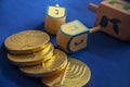 Jewish holiday Hanukkah with wooden dreidel and chocolate coins Royalty Free Stock Photo