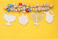 jewish holiday Hanukkah with wooden dreidels (spinning top) Royalty Free Stock Photo