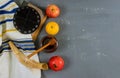 Jewish holiday honey and apples with pomegranate torah book, kippah a yamolka talit