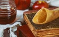 Jewish holiday Rosh Hashana honey and apples with pomegranate torah book, kippah a yamolka talit