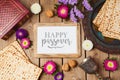 Jewish holiday Passover background with photo frame, matza and seder plate.