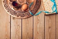 Jewish holiday Passover concept with matzah, seder plate, egg and wine on wooden background. Royalty Free Stock Photo