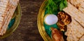 Jewish holiday passover matzot with seder on plate on table close up