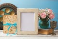 Jewish holiday Passover Pesah concept with poster photo frame, matzoh and rose flowers bouquet